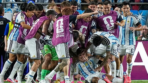 Argentina's Julian Alvarez (9) is congratulated by teammates after scoring his team's second goal during the World Cup quarterfinal soccer match between Argentina and Switzerland in Kansas City, Mo.