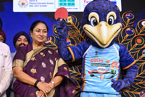 Delhi Chief Minister Rekha Gupta with the mascot of Commonwealth Table Tennis Championship during its unveiling ceremony, in New Delhi.