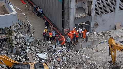 NDRF personnel at the site after a three-storey administrative building of a Waste-to-Energy (WTE) plant run by the Pimpri Chinchwad Municipal Corporation collapsed when an adjacent mound of garbage fell onto the structure like a landslide, in Pune district