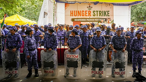 New Delhi: Security personnel stand guard as activist Sonam Wangchuk, unseen, who has been on an indefinite hunger strike for 21 days, is shifted to a hospital from Jantar Mantar, in New Delhi, Saturday, July 18, 2026.