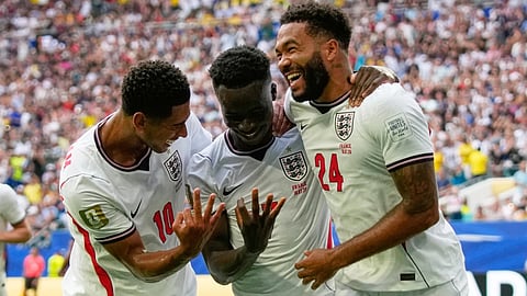 England's Bukayo Saka celebrates his third goal against France with Jude Bellingham and Reece James