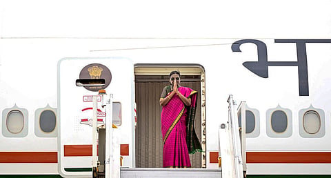President Droupadi Murmu greets as she emplanes on state visits to Moldova, North Macedonia and Romania.