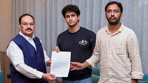 Union Minister JP Nadda, left, meets Cockroach Janta Party (CJP) spokespersons Saurav Das and Ashutosh Ranka amid an ongoing protest by CJP over the alleged NEET paper leak, in New Delhi