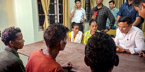 Officials speak with the family members of the victims, who were killed in the collapse inside the under-construction NHPC Teesta Stage VI Hydroelectric Project tunnel, in Namchi, Tuesday, July 21