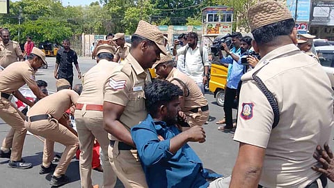 Police forcibly removing DYFI members in Tiruchy on Wednesday