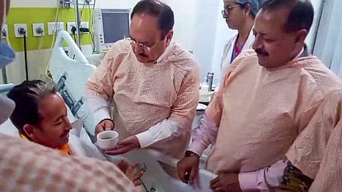 Union Health Minister JP Nadda offers a drink to social activist and educator Sonam Wangchuk as Union Minister of State Jitendra Singh looks on during the breaking of Wangchuk's 26-day indefinite hunger strike, at Medanta Hospital