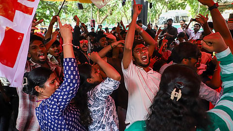Protesters celebrating after news about Union Minister Dharmendra Pradhan's resignation was announced at CPI headquarters in T Nagar on Saturday