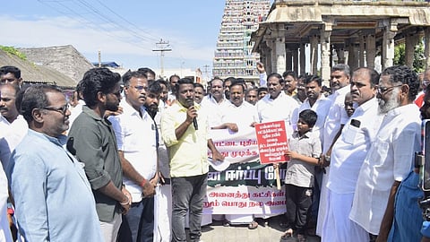 Members of various organisations and the public march to DRO office at Mannargudi on Saturday (July 25).