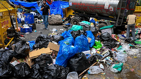 Garbage lies strewn at the site amid the ongoing protest demanding the resignation of Union Education Minister Dharmendra Pradhan over the NEET paper leak issue