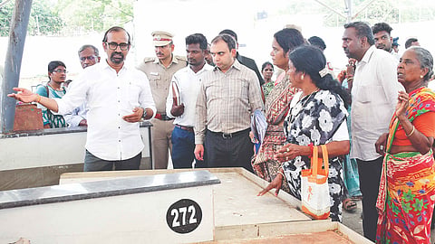 Minister P Venkataramanan with officials at the fish market