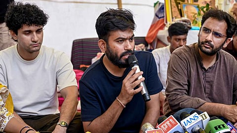 Cockroach Janta Party (CJP) founder Abhijeet Dipke addresses a press conference as party spokepersons Saurav Das and Ashutosh Ranka look on, amid the ongoing protest over NEET paper leak issue, at Jantar Mantar, in New Delhi, Friday, July 24, 2026