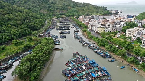 In this photo released by Xinhua News Agency, a drone photo shows fishing boats taking shelter ahead of Typhoon Noul at a port in Shenzhen-Shanwei Special Cooperation Zone in southern China’s Guangdong Province.