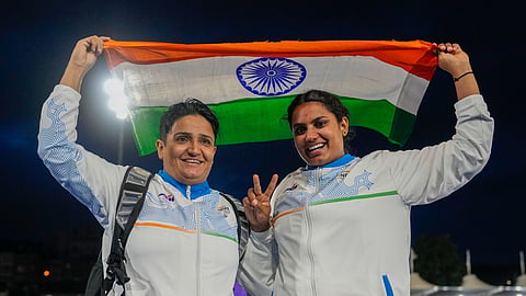 India's Sharmila Dhankar, left, and Shilpa K Shyla celebrate after winning gold and bronze medals respectively in the women's shot put F57 at the 23rd Commonwealth Games, in Glasgow, Scotland, Monday.