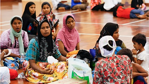 Illegal immigrants from Myanmar rest at a temporary immigration detention center in Langkawi, Malaysia.