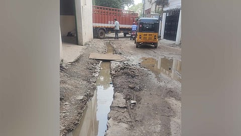 The pit dug up for the stormwater drain maintenance filled with rainwater on Pillaiyar Koil Street