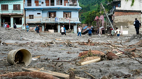 A collapsed infrastructure over a swollen river following the devastating flash floods at Devighat village, in Nuwakot district, Nepal, Friday, Aug. 28, 2026.