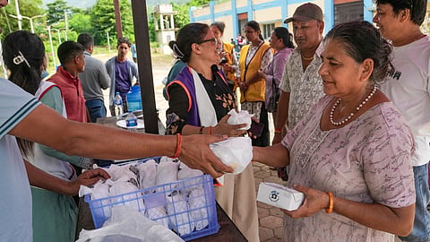 A flood victim at a relief camp set up at an ayurvedic hospital following devastating flash floods, in Kathmandu, Nepal