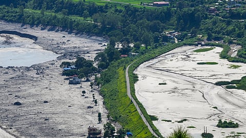 A residential area covered in thick mud in the aftermath of flash floods, at Trishuli market, in Nuwakot district