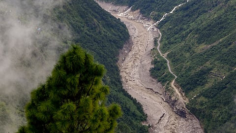View of a flood-affected valley, where water of the Bhange Jharna and other waterfalls are seen cascading into the Trishuli river
