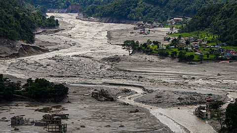 A view of damaged and half-buried buildings under silt and debris following devastating flash floods, at Betrawati market, in Nuwakot district, Nepal
