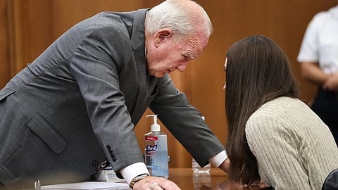 Defense attorney Kevin Reddington talks with Lindsay Clancy after a jury question during her trial in Plymouth, Mass