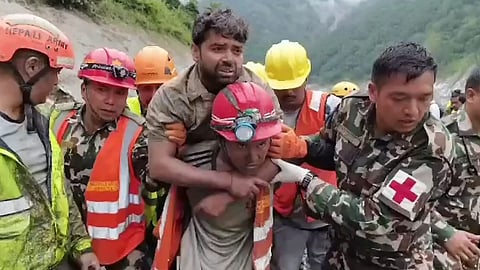 Sanjay Sah, 30, being rescued alive from a tunnel at the Trishuli 3A hydropower project 10 days after the Bhotekohi flash floods disaster, in Rasuwa district, Nepal.