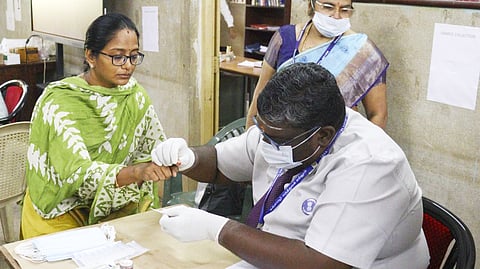 Blood samples being taken.