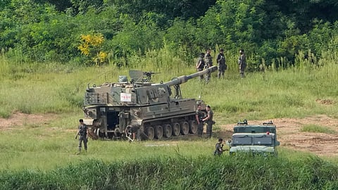 South Korean army soldiers work near their K-9 self-propelled howitzer in Paju, South Korea, near the border with North Korea.