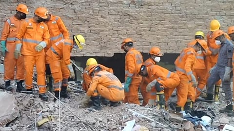 NDRF personnel conduct a rescue operation on the second day after a 50-year-old five-storey building housing a boys' hostel collapsed in a congested bylane in Satya Niketan near Delhi University's south campus, Monday, Sept. 7, 2026
