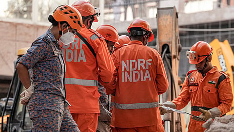 Rescue personnel conduct a rescue operation on the second day after a 50-year-old five-storey building housing a boys' hostel collapsed in a congested bylane in Satya Niketan near Delhi University's south campus, Monday, Sept. 7, 2026. The death toll in the building collapse in southwest Delhi's Satya Niketan area climbed to six