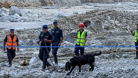 Nepal Police personnel conduct search and rescue operation following the devastating flash floods