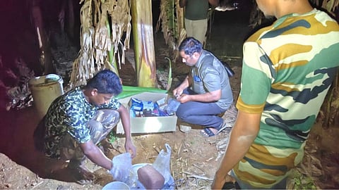 Forest staff mix medicine on ragi cakes in a farm in Coimbatore to feed the injured elephant