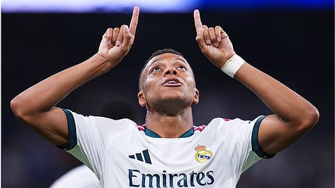 Real Madrid's Kylian Mbappe celebrates scoring his side's 4th goal during the Spanish La Liga soccer match between Real Madrid and Rayo Vallecano in Madrid, Spain.