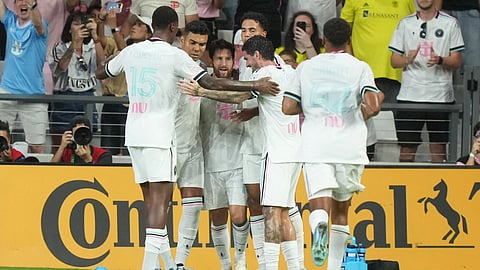 Inter Miami players celebrate Nashville's own goal during the first half of an MLS soccer match in Miami.