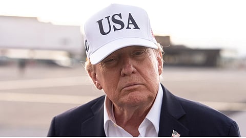 President Donald Trump speaks with reporters before boarding Air Force One at Shannon Airport.