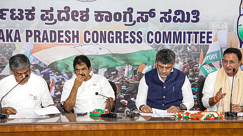Karnataka Chief Minister DK Shivakumar, second right, looks on as AICC General Secretary and Karnataka In-charge Randeep Singh Surjewala, right, addresses the meeting with the newly appointed District Congress Presidents, at the KPCC office, in Bengaluru, Wednesday, Sept. 16, 2026. AICC General Secretary (Organisation) KC Venugopal, second left, and KPCC President BK Hariprasad are also seen
