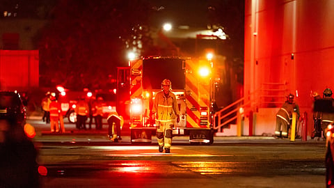 First responders work the scene after a helicopter crashed near a bus crash in Chatsworth, a neighborhood in Los Angeles, Tuesday, Sept. 15, 2026.
