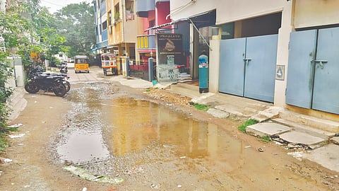 Battered and dusty 100-metre stretch of 4th Main Road in VGN Nagar
