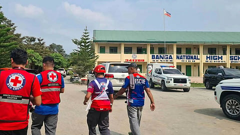In this handout photo provided by the Philippine Red Cross, Red Cross members arrive at Banga National High School in the town of Banga, Philippines, Friday, Sept. 18, 2026.