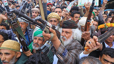 Supporters of Yemen's Houthi rebels raise their rifles during a rally in support of the group and to protest Saudi Arabia's accusation that the Houthis targeted Islam's holiest site of Mecca, in Sanaa, Yemen
