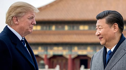 President Donald Trump, left, and Chinese President Xi Jinping tour the Forbidden City