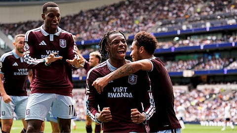 Aston Villa's Johan Manzambi celebrates with teammates after scoring the opening goal during the English Premier League soccer match between Tottenham Hotspur and Aston Villa, at Tottenham Hotspur Stadium in London.