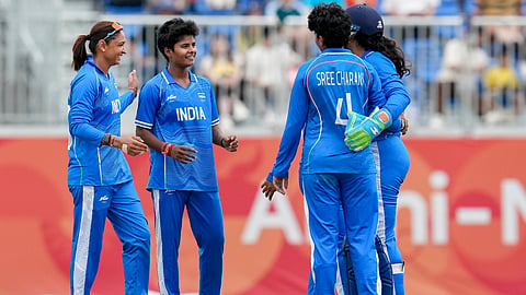 India's captain Harmanpreet Kaur, left, Shree Charani, 4, and Kranti Gaud, second left, celebrate after the wicket of Bangladesh's captain Nigar Sultana during the second semifinal T20I cricket match between India's women and Bangladesh's women in the ongoing Asian Games 2026, at Aichi Prefectural Korogi Sports Park in Nisshin, Japan, Sunday, Sept. 20, 2026.