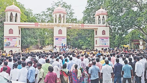 Families and supporters of the deceased gather outside Collectorate campus near Maruthupandiyar Nagar on Saturday