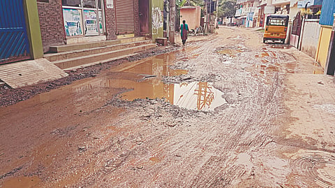 Pothole-ridden RR Nagar 6th Street turns slushy after a mild shower