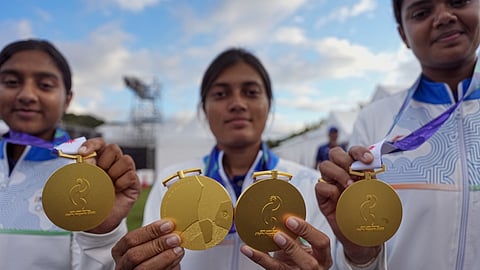 Gold medallists, from left, India's Prithika Pradeep, Chikitha Taniparthi and Jyothi Surekha Vennam pose for photographs after the compound women's team archery event at the 20th Asian Games, in Nagoya, Japan, Wednesday, Sept. 30, 2026