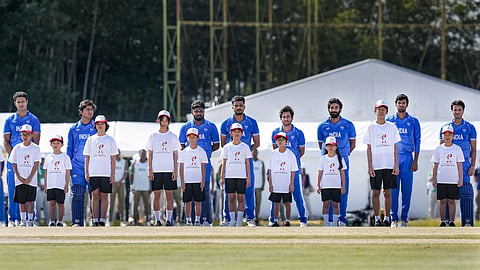 India's players and others stand during the national anthem before the final T20I cricket match between India and Pakistan, at the 20th Asian Games, in Nisshin, Japan.