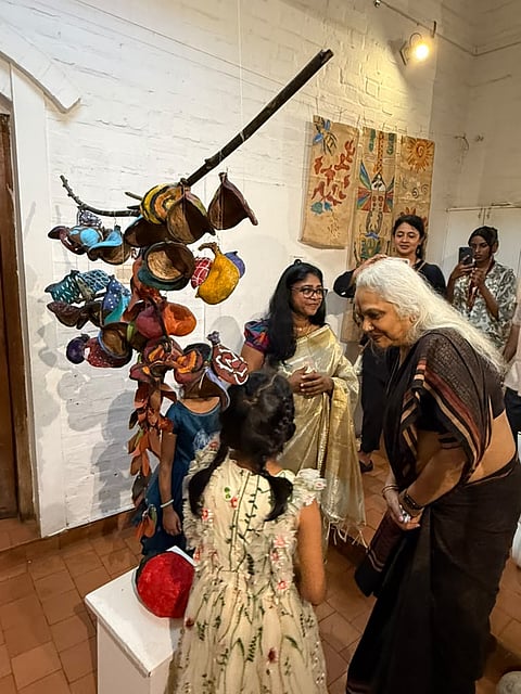 A child explaining her work during the inauguration