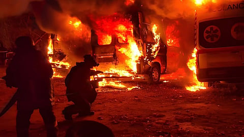 Rescue workers put out a fire of ambulances after a Russian strike on medical facility of Kramatorsk, Ukraine.
