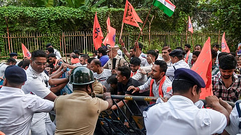 Bangiya Hindu Jagaran Mancha attempt to climb the main gate of Satyajit Ray Film and Television Institute (SRFTI) during a protest against the September 27 clash on the campus between a section of the students and members of the Akhil Bharatiya Grahak Panchayat (ABGP), in Kolkata